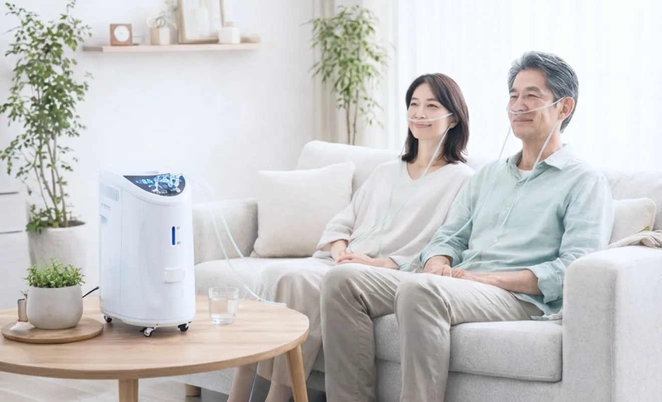 水素ガス吸入チューブを装着し、医療機関用水素ガス生成器で2人同時に水素ガスを吸入する男女